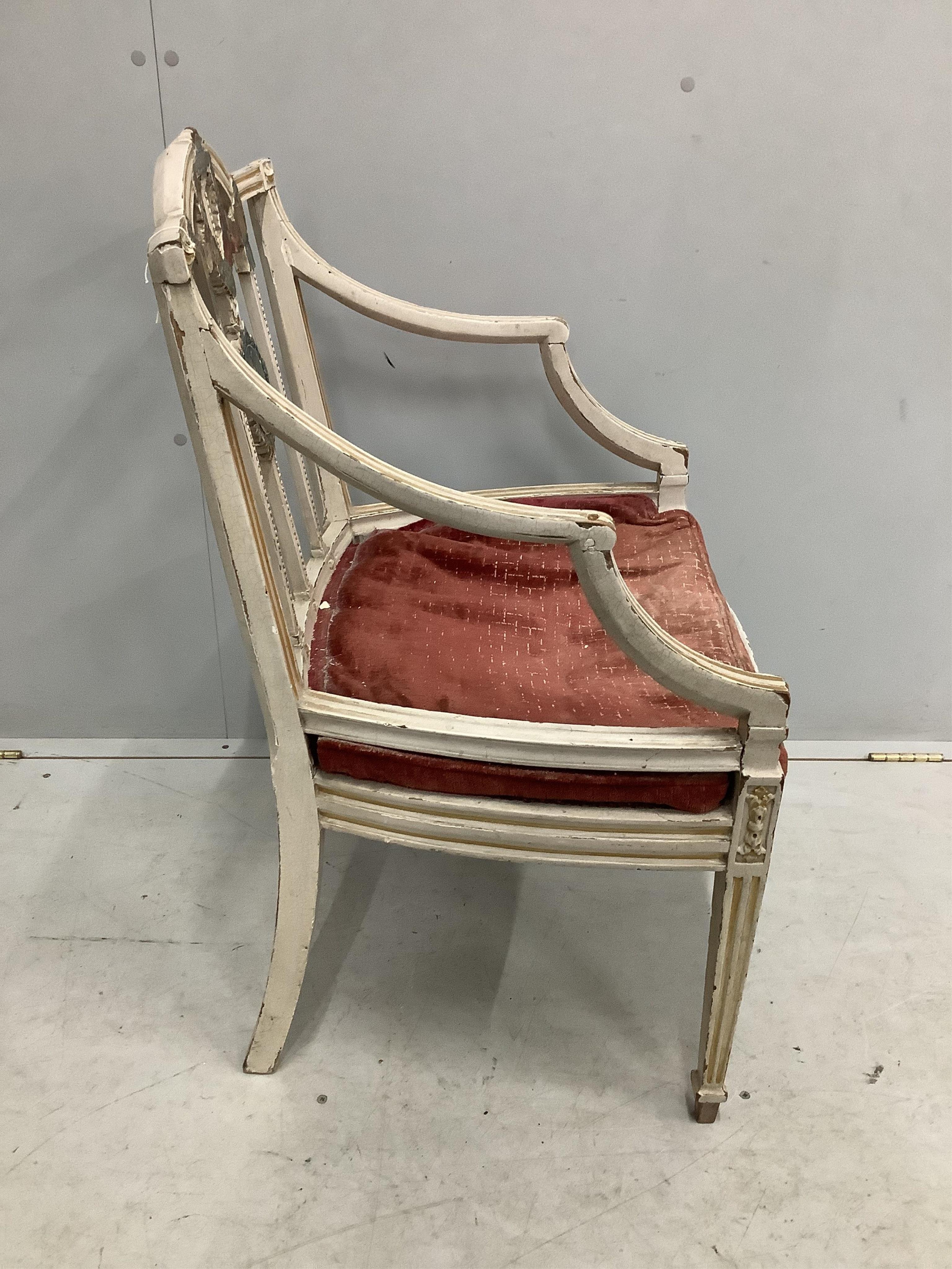 An Edwardian Sheraton revival painted elbow chair, width 56cm, depth 48cm, height 89cm. Condition - fair